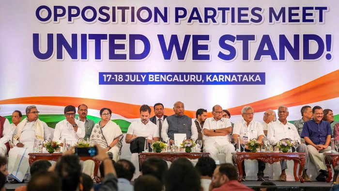 Congress President Mallikarjun Kharge, party leader Rahul Gandhi, West Bengal CM Mamata Banerjee, Delhi CM Arvind Kejriwal, NCP supremo Sharad Pawar and others at a press conference in Bengaluru on July 18, where the opposition parties named their new alliance I.N.D.I.A. Credit: PTI Photo