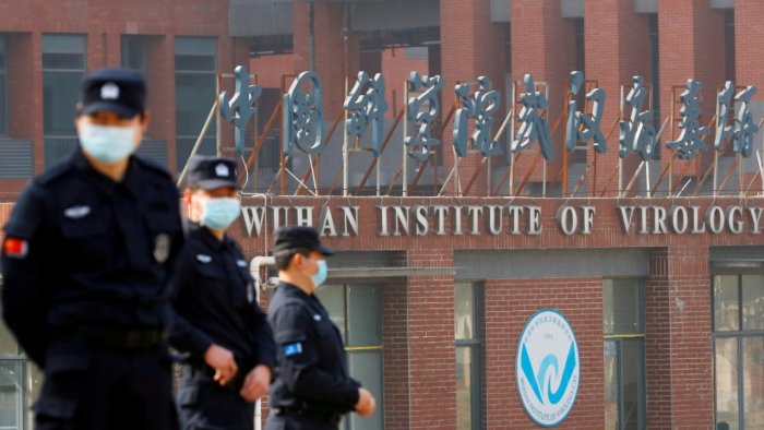 Security personnel keep watch outside the Wuhan Institute of Virology during the visit by the World Health Organization team. Credit: Reuters Photo